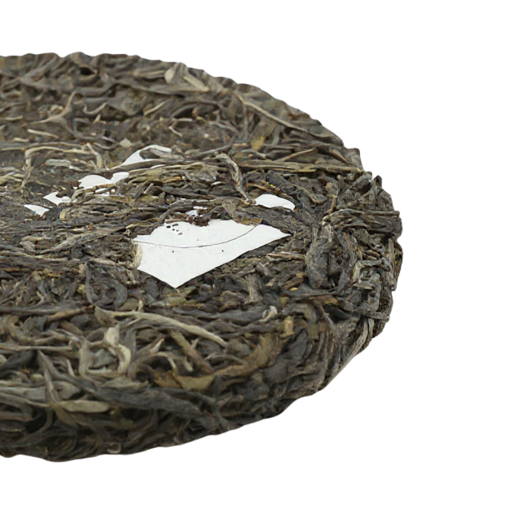 Tea & Leaf Spring 2024 Tianmen Mountain Core Region Tall Arbor Ancient Tree Raw Pu-erh Tea Cake 200g – Close-Up of Unwrapped Compressed Tea Leaves