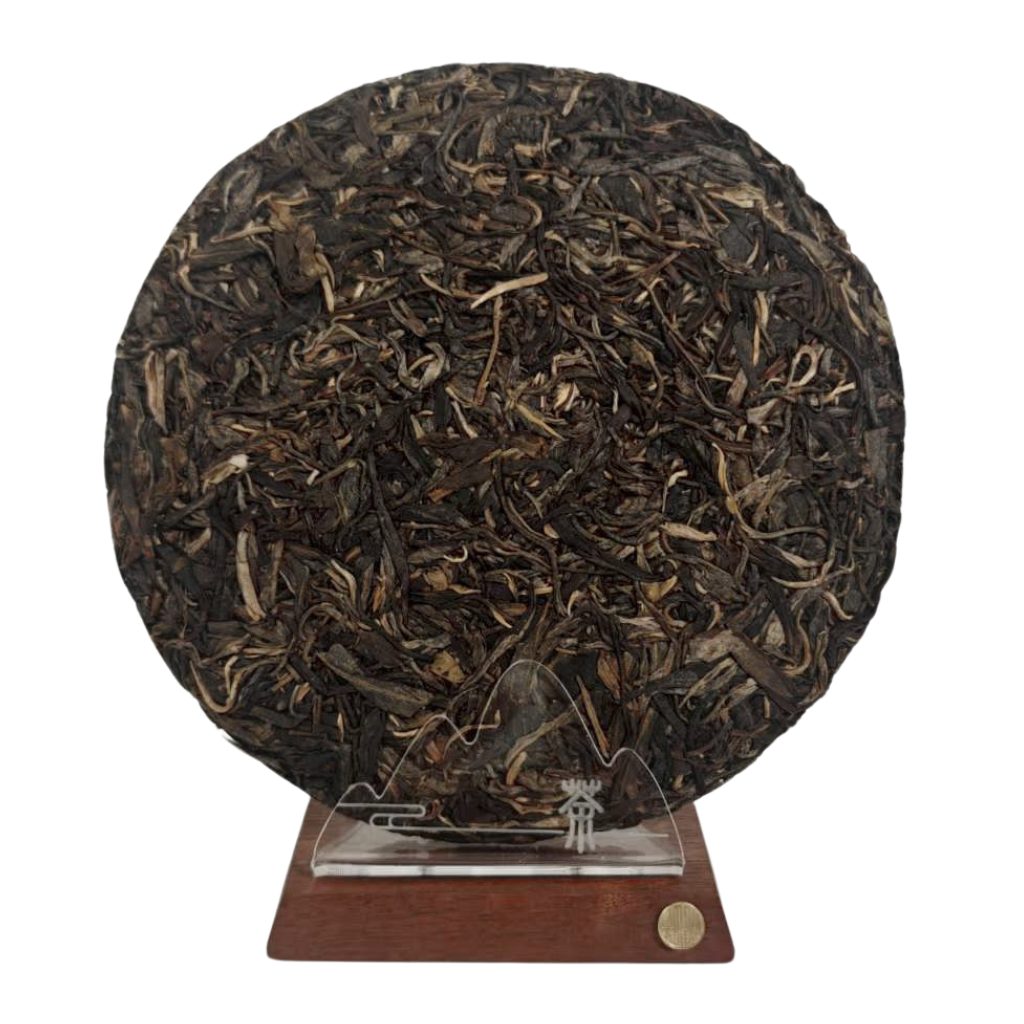 Unwrapped 2018 Yiwu Mahei Ancient Tree Raw Pu-erh Tea 357g cake by Tea & Leaf — whole leaf Sheng Pu-erh from Yunnan with rich aroma, smooth texture, and balanced aged flavor.